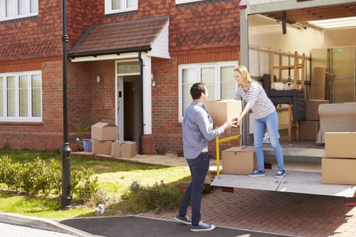 Removal team planning a house move in a Brixton street