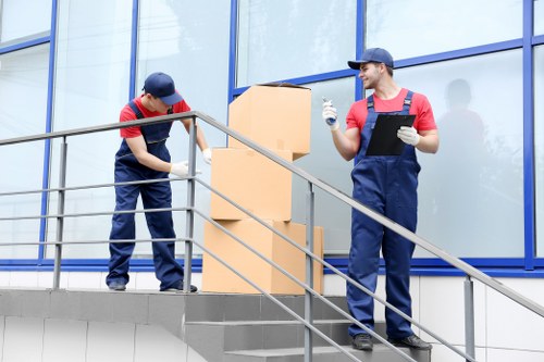 Removal team planning a Brixton home move near a busy South London street