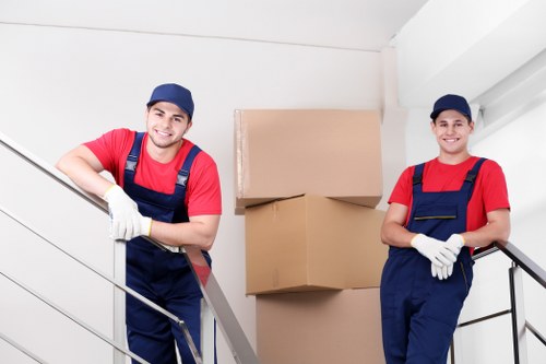 Relocation crew handling desks and equipment during an office move