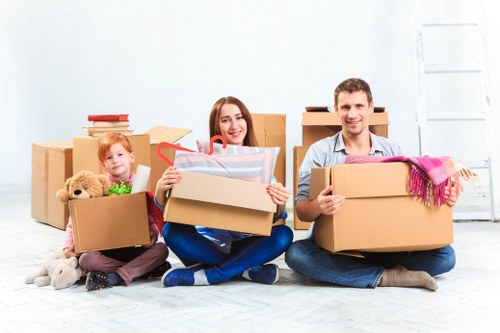 Furniture being carried down stairs in a Brixton flat move