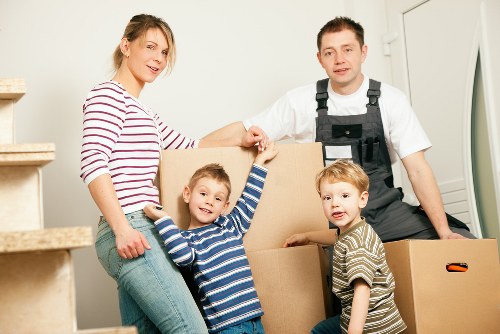 Furniture and boxes being moved carefully from a Brixton flat with stairs