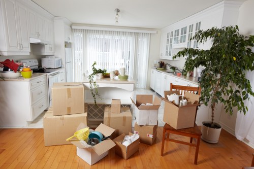 Moving team handling boxes and furniture in Brixton