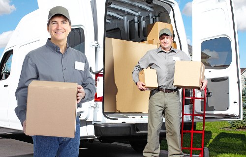 Packed moving boxes and furniture prepared for Brixton removals