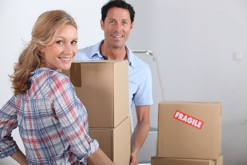 Packed moving boxes and furniture ready for transport in Brixton