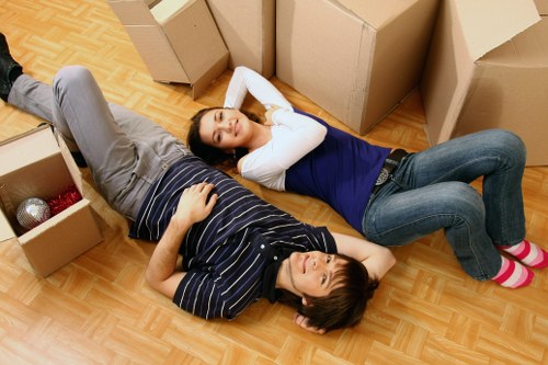 Packed moving boxes and protective wrapping ready for a Brixton removal service