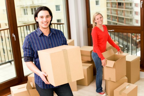 Packed moving boxes and household items ready for removals in Brixton